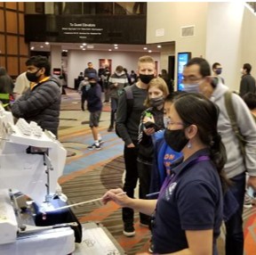 Live event embroidery - Scholastic Chess Tournament in Hilton Bellevue. Embroidering chess-themed hats and hoodies
