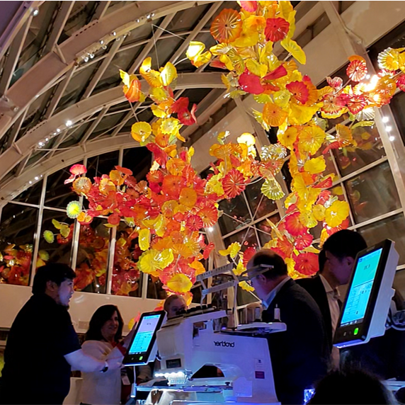 Live event embroidery - Monogramming scarves and pashminas during an Amazon Business Dinner at the Chihuly Glass and Garden in downtown Seattle