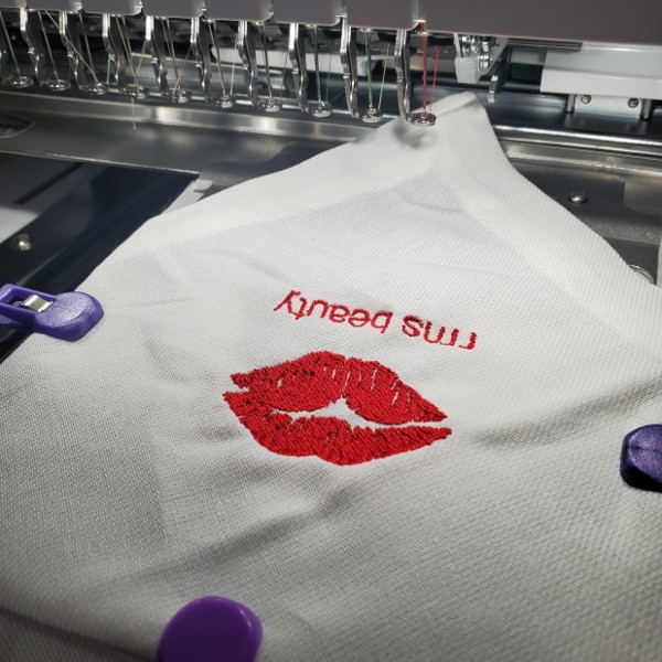 Custom Embroidered Cocktail napkins used in RMS Beauty dinner in New York City hosted by Rose-Marie Swift herself