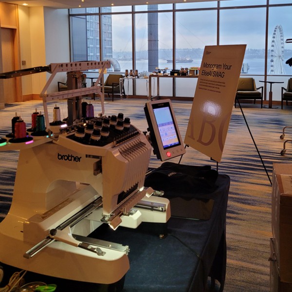 Live Event Embroidery - EliseAI Leadership Conference in Four Seasons Hotel in Downtown Seattle.  Monogrammed sweaters and tote bags.